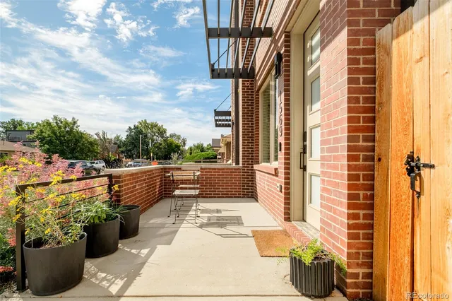 a view of balcony with a potted plant