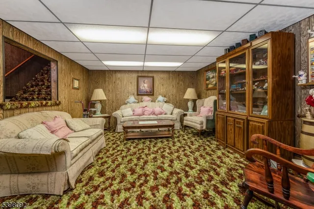 a bedroom with furniture and wooden floor