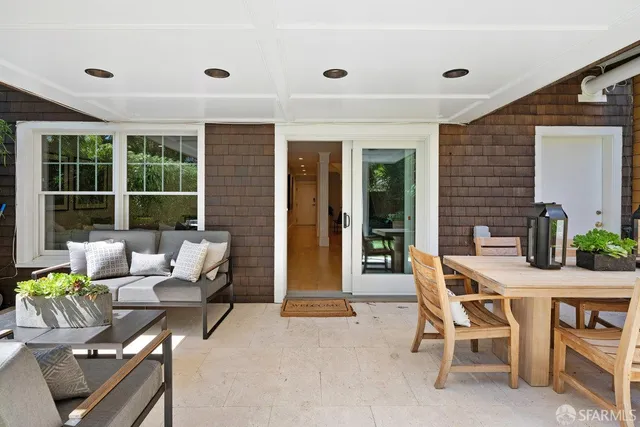 a outdoor space with patio the couches and a dining table with garden view