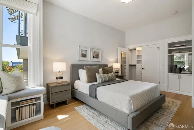 a room with a bed and a view of bedroom