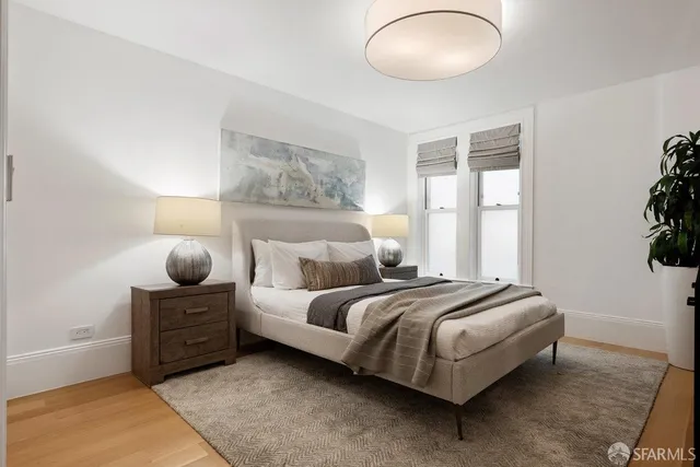 a bedroom with a bed and window