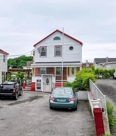 a car parked in front of a house