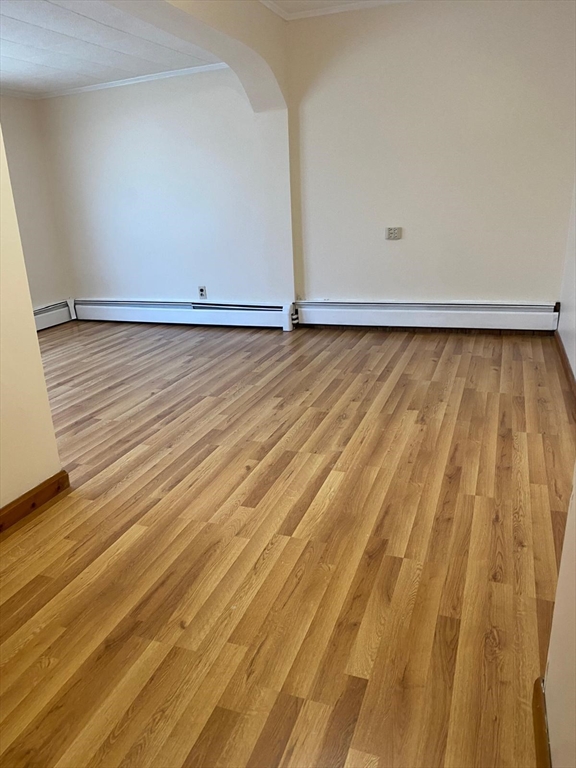 38 Chapel Street, Unit 1 Lowell, MA 01852 - Photo 13 of 18 a view of room with wooden floor