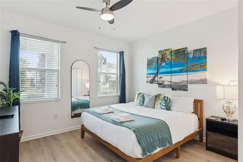 a bedroom with a bed and cabinets