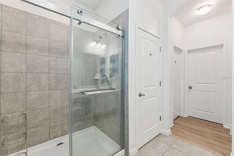 a bathroom with double vanity sinks and a mirror