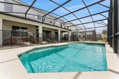 an aerial view of a house with a lake view
