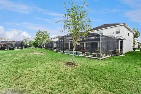 a room with patio furniture and a potted plant