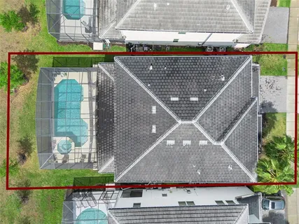 a view of a house with swimming pool and sitting area