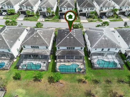 a view of a patio with a table and chairs