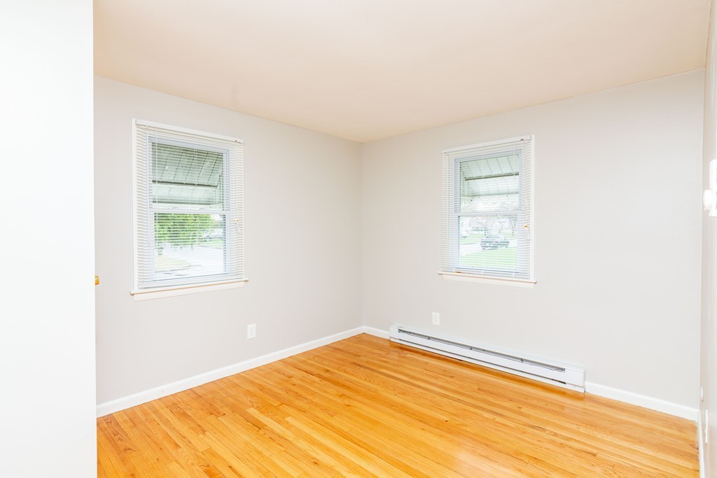 63 Finch Road Springfield, MA 01119 - Photo 11 of 18 a bedroom with a bed and a window