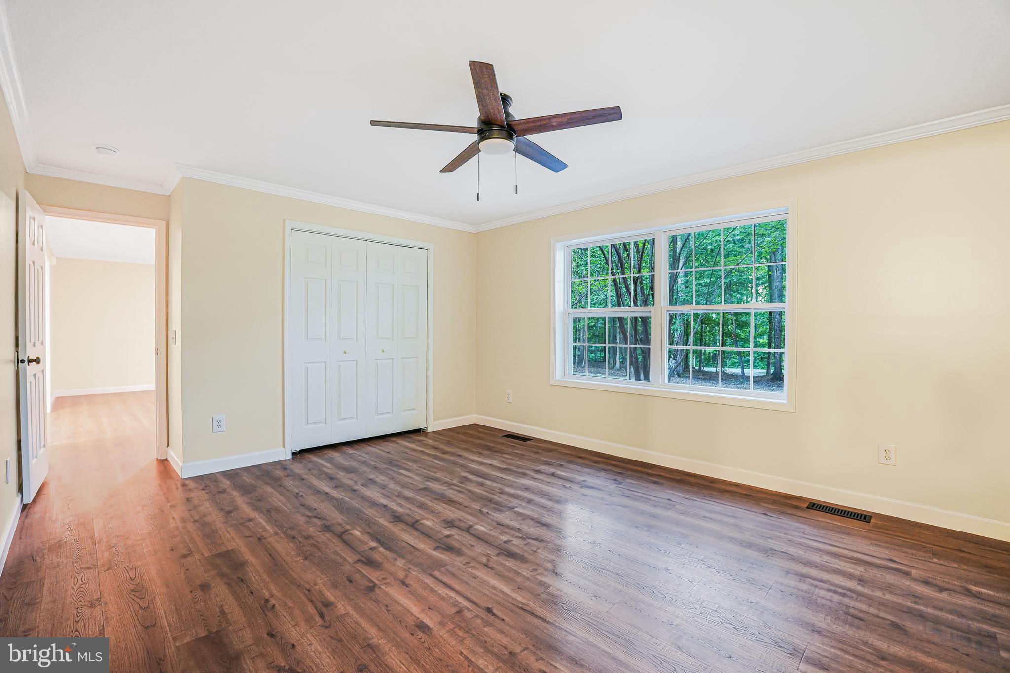 767 Loving Road Zion Crossroads, VA 22942 - Photo 20 of 33 a view of empty room with wooden floor and fan