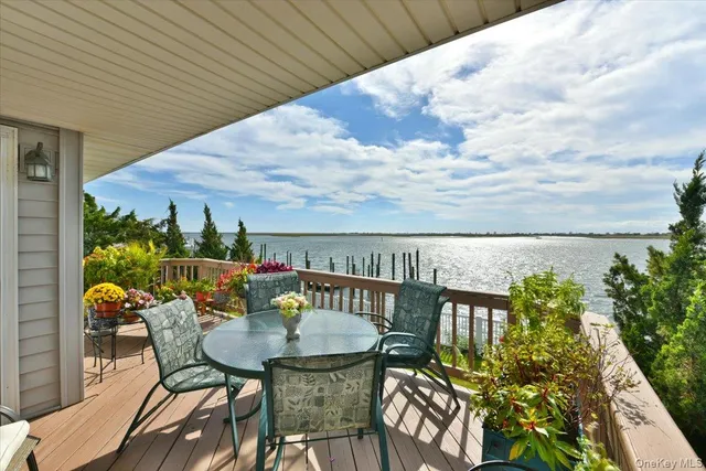 a terrace with outdoor seating and city view