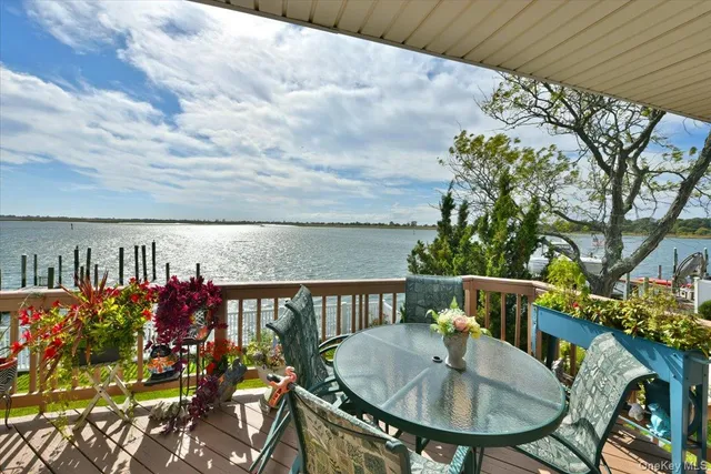a terrace with outdoor seating and wooden floor