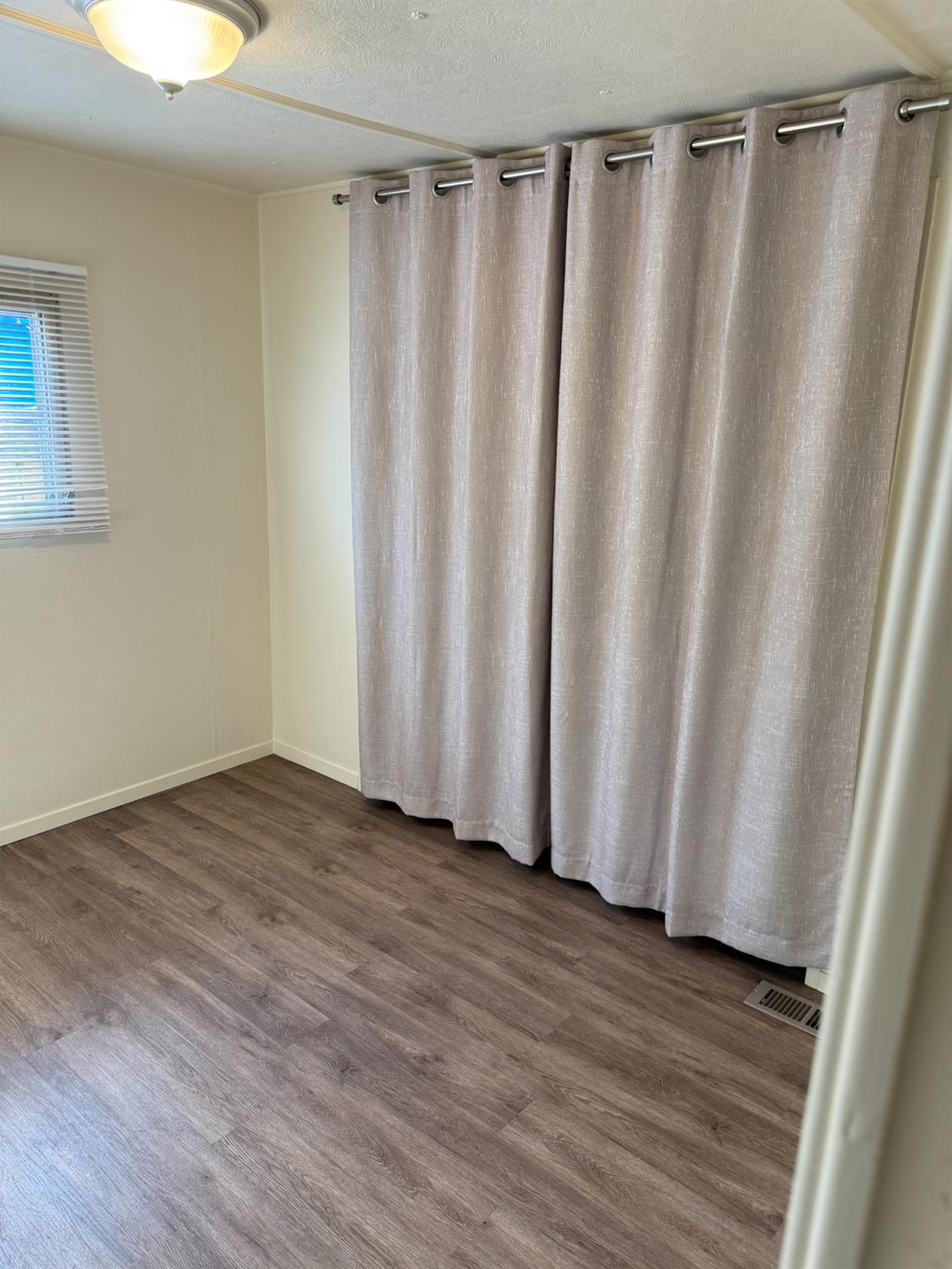 2107 Patterson Road, Unit 31 Riverbank, CA 95367 - Photo 11 of 34 a view of a utility room with wooden floor and a window