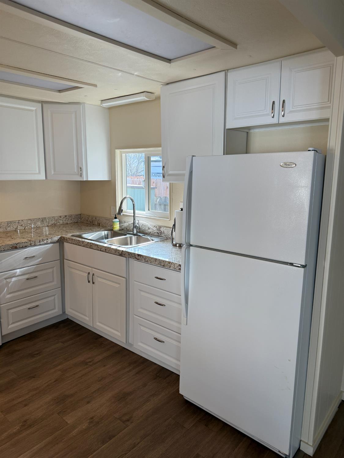 2107 Patterson Road, Unit 31 Riverbank, CA 95367 - Photo 5 of 34 a kitchen with appliances a sink and a refrigerator