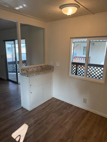 a view of kitchen with wooden floor