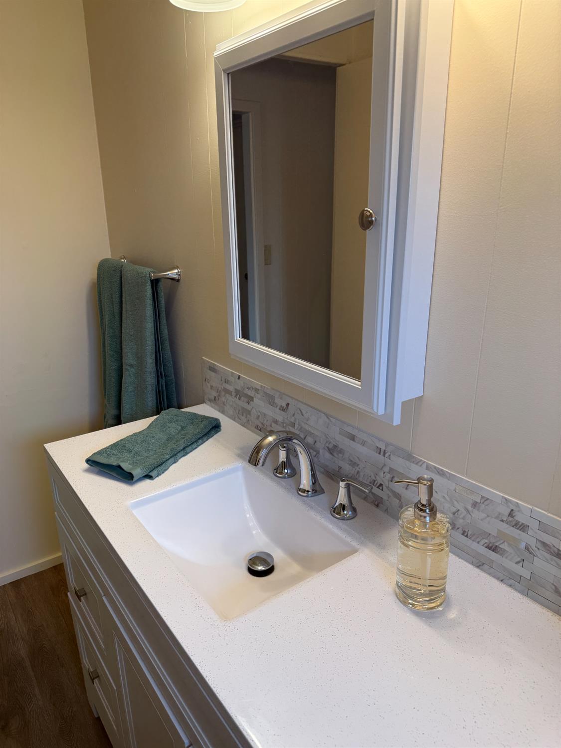 2107 Patterson Road, Unit 31 Riverbank, CA 95367 - Photo 8 of 34 a bathroom with a sink and a mirror