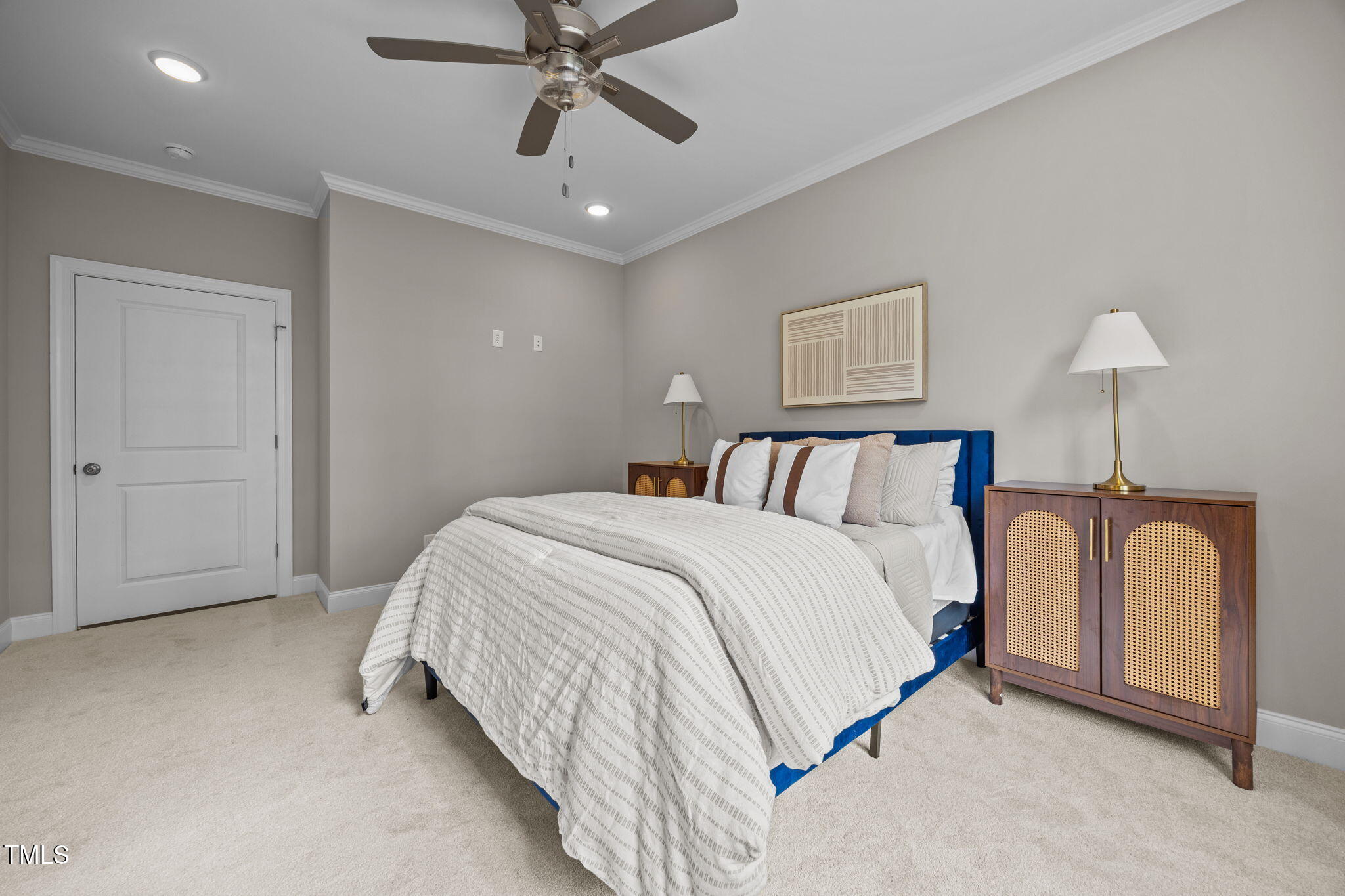 4167 Old Stage Road North Angier, NC 27501 - Photo 24 of 34 a spacious bedroom with a bed and a chandelier