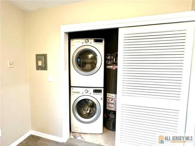 a view of a hallway with washer and dryer
