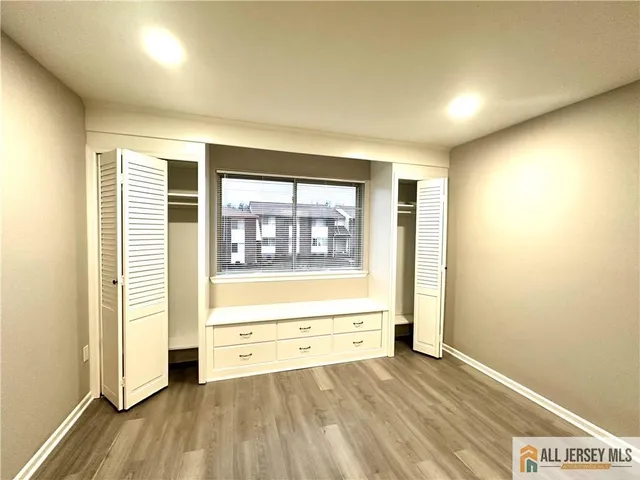 a view of an empty room and a window