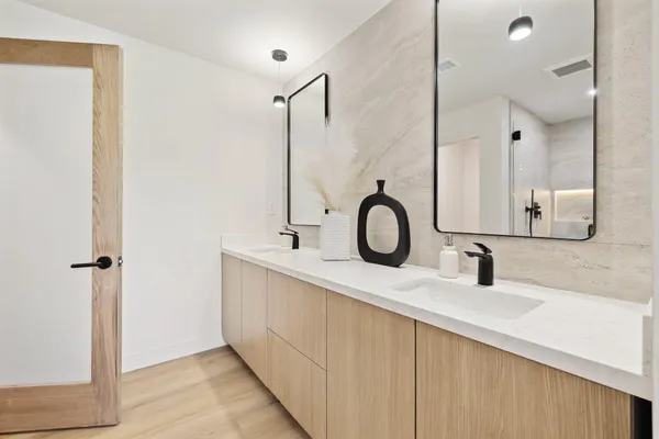 a bathroom with a sink and a mirror