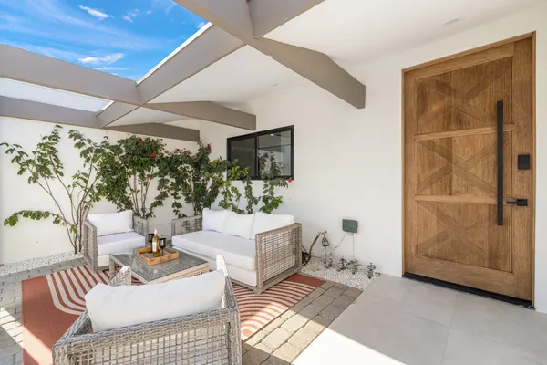 a living room with furniture and a window