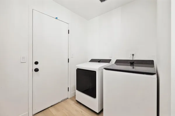 a utility room with dryer and washer