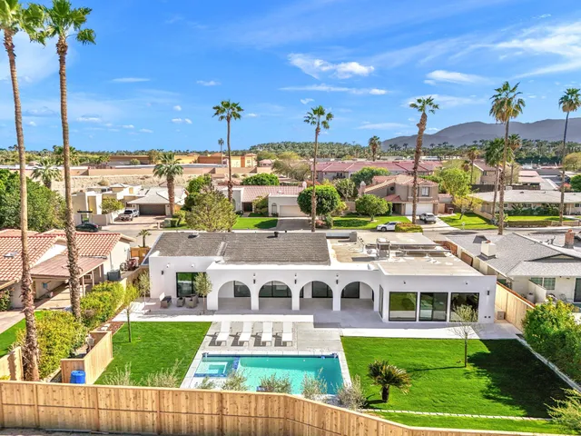 a front view of building with yard