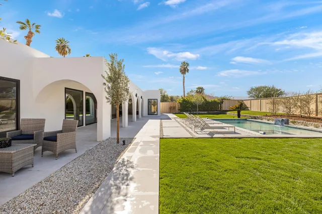 a view of a swimming pool with a chairs