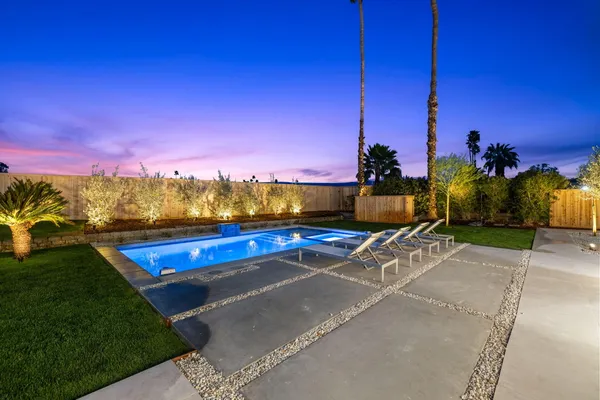 a view of an outdoor space yard swimming pool and outdoor seating