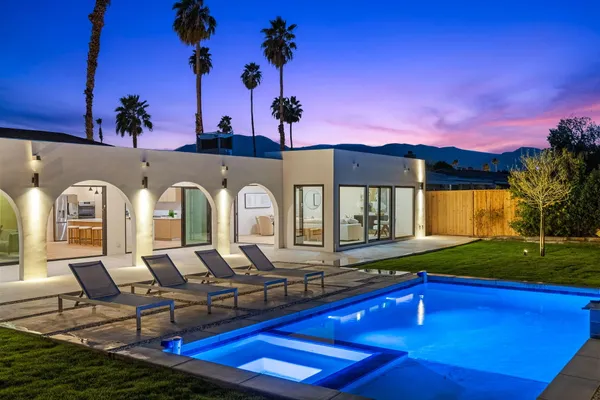 a view of a chairs and table in the patio