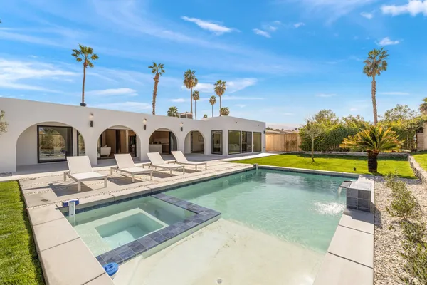 a view of a house with swimming pool