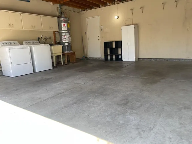 a view of storage and utility room with wooden floor