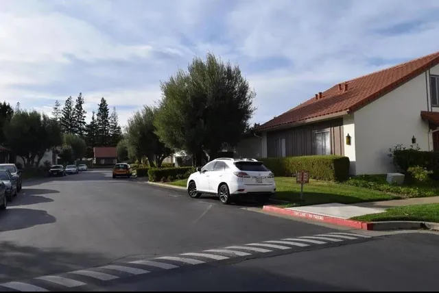 a view of street with parked cars