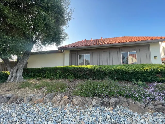 a house with trees in the background