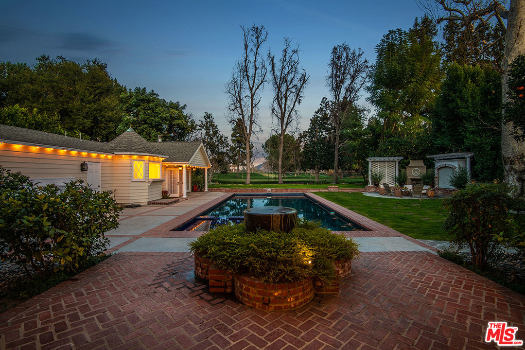 20 Toluca Estates Drive Toluca Lake, CA 91602 - Photo 11 of 46 a view of a swimming pool with a garden