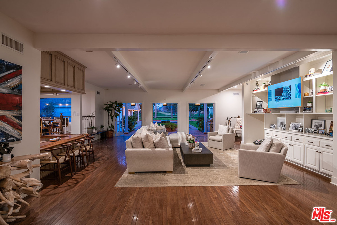20 Toluca Estates Drive Toluca Lake, CA 91602 - Photo 13 of 46 a living room with fireplace furniture and a wooden floor
