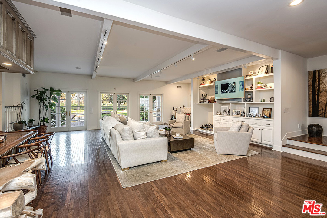 20 Toluca Estates Drive Toluca Lake, CA 91602 - Photo 14 of 46 a living room with fireplace furniture and a wooden floor
