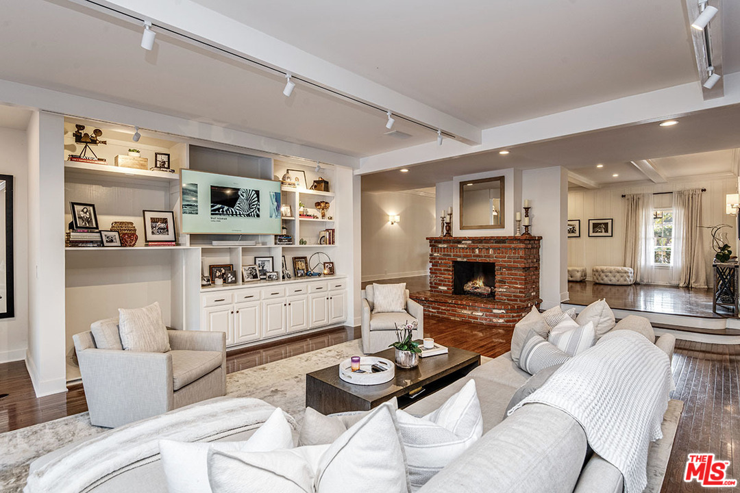 20 Toluca Estates Drive Toluca Lake, CA 91602 - Photo 15 of 46 a living room with furniture and a fireplace
