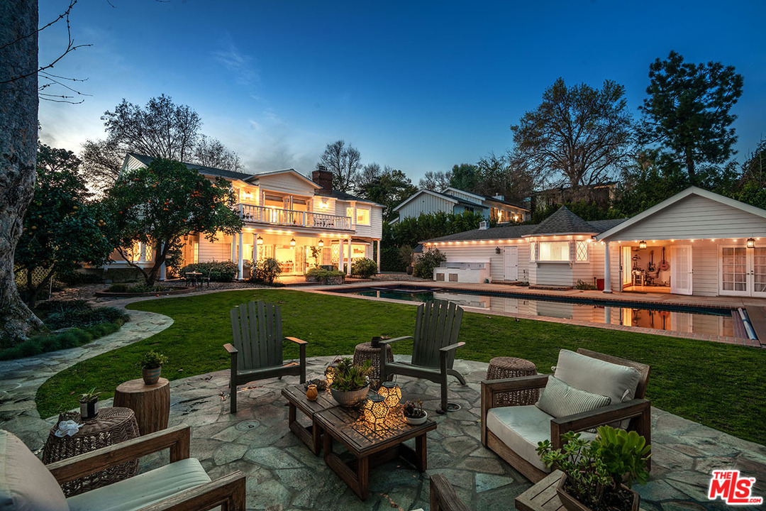 20 Toluca Estates Drive Toluca Lake, CA 91602 - Photo 3 of 46 a backyard of a house with table and chairs