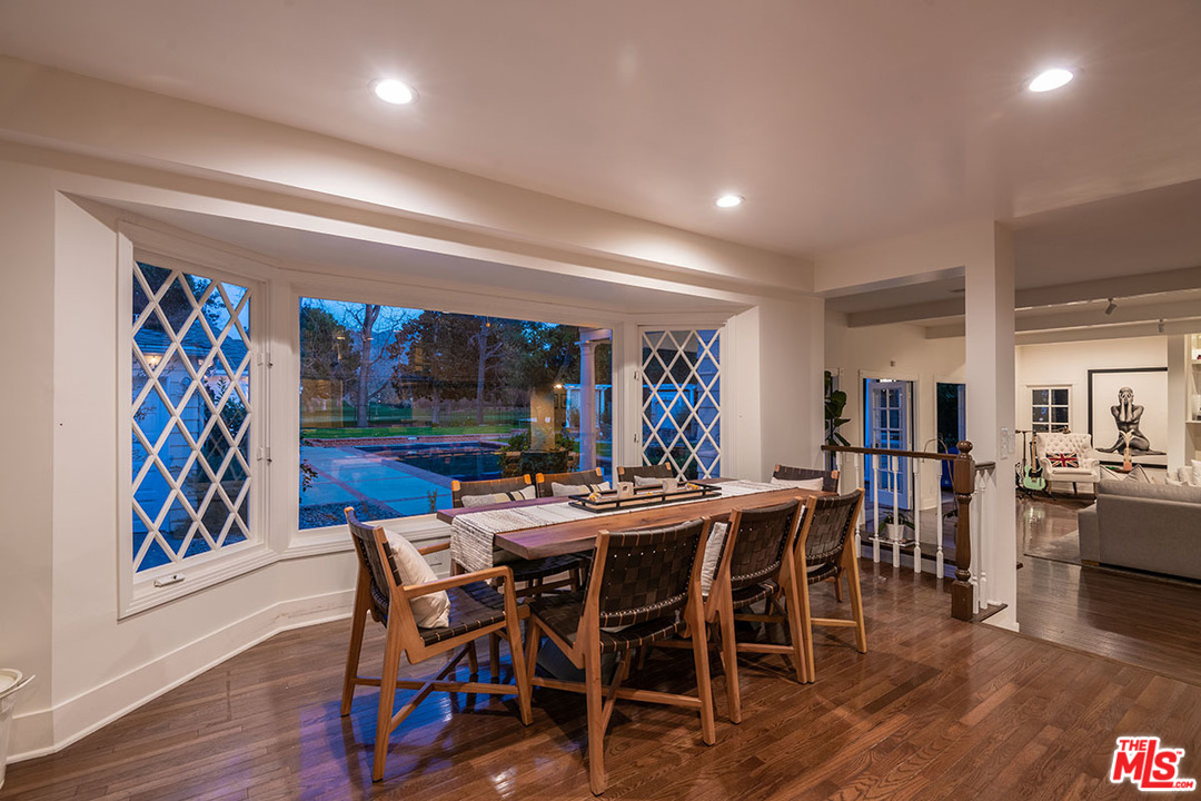 20 Toluca Estates Drive Toluca Lake, CA 91602 - Photo 21 of 46 a view of a dining room with furniture and wooden floor