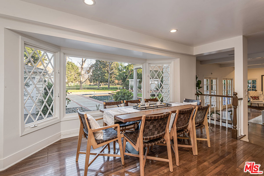 20 Toluca Estates Drive Toluca Lake, CA 91602 - Photo 22 of 46 a view of a dining room with furniture window and wooden floor