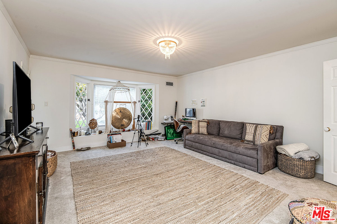 20 Toluca Estates Drive Toluca Lake, CA 91602 - Photo 28 of 46 a living room with furniture and a mirror