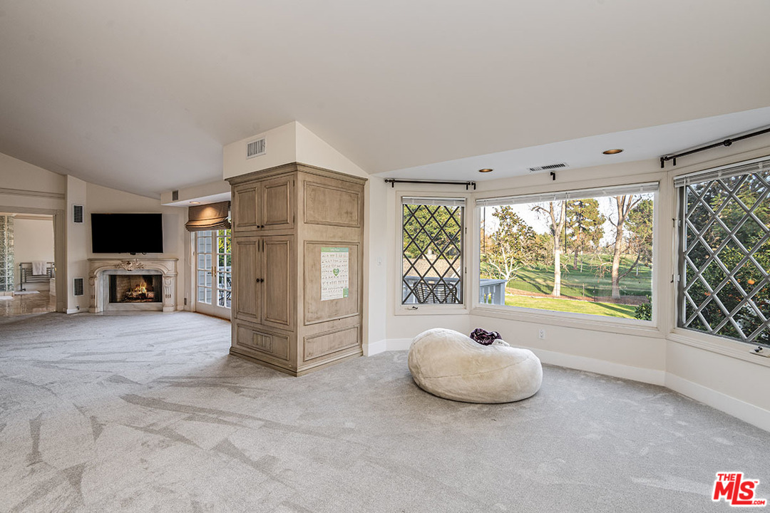 20 Toluca Estates Drive Toluca Lake, CA 91602 - Photo 30 of 46 a living room with furniture and a flat screen tv