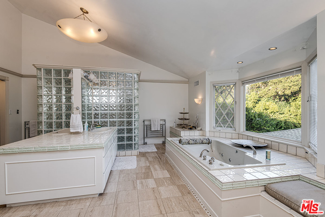 20 Toluca Estates Drive Toluca Lake, CA 91602 - Photo 31 of 46 a large white kitchen with a large window and sink