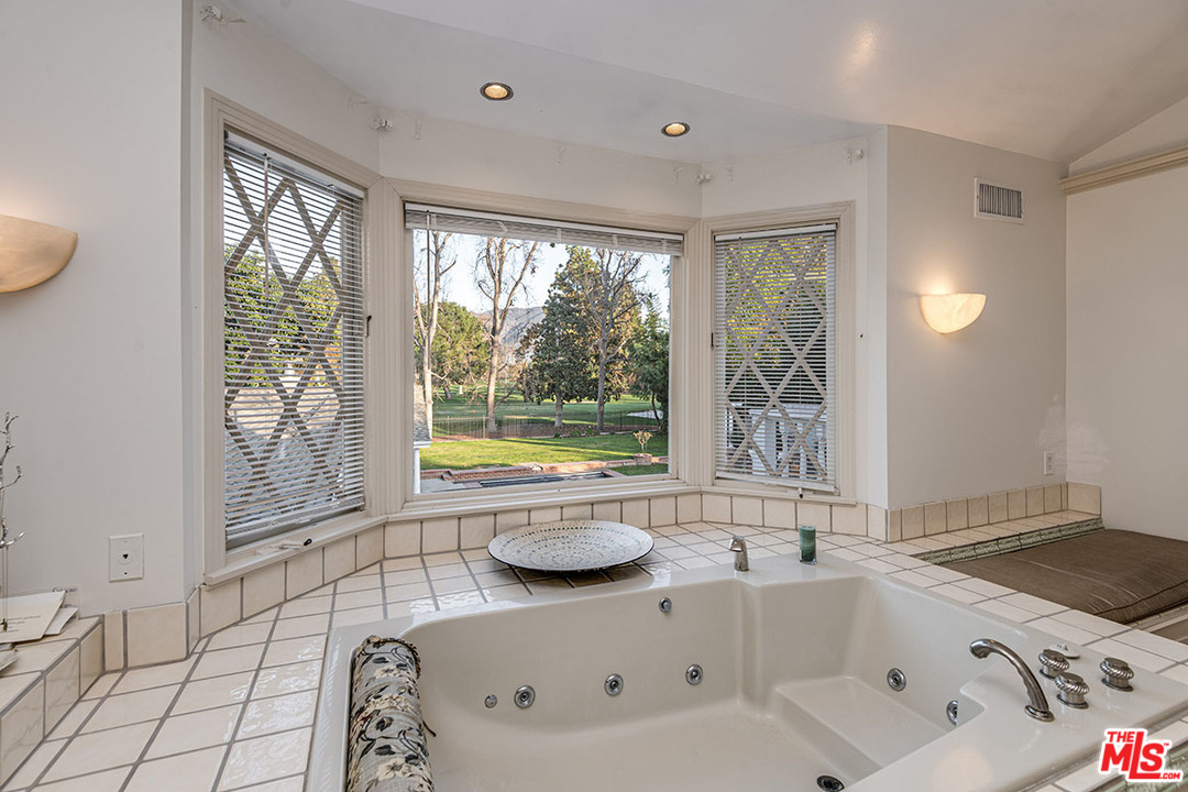 20 Toluca Estates Drive Toluca Lake, CA 91602 - Photo 32 of 46 a bathroom with a bathtub and a sink
