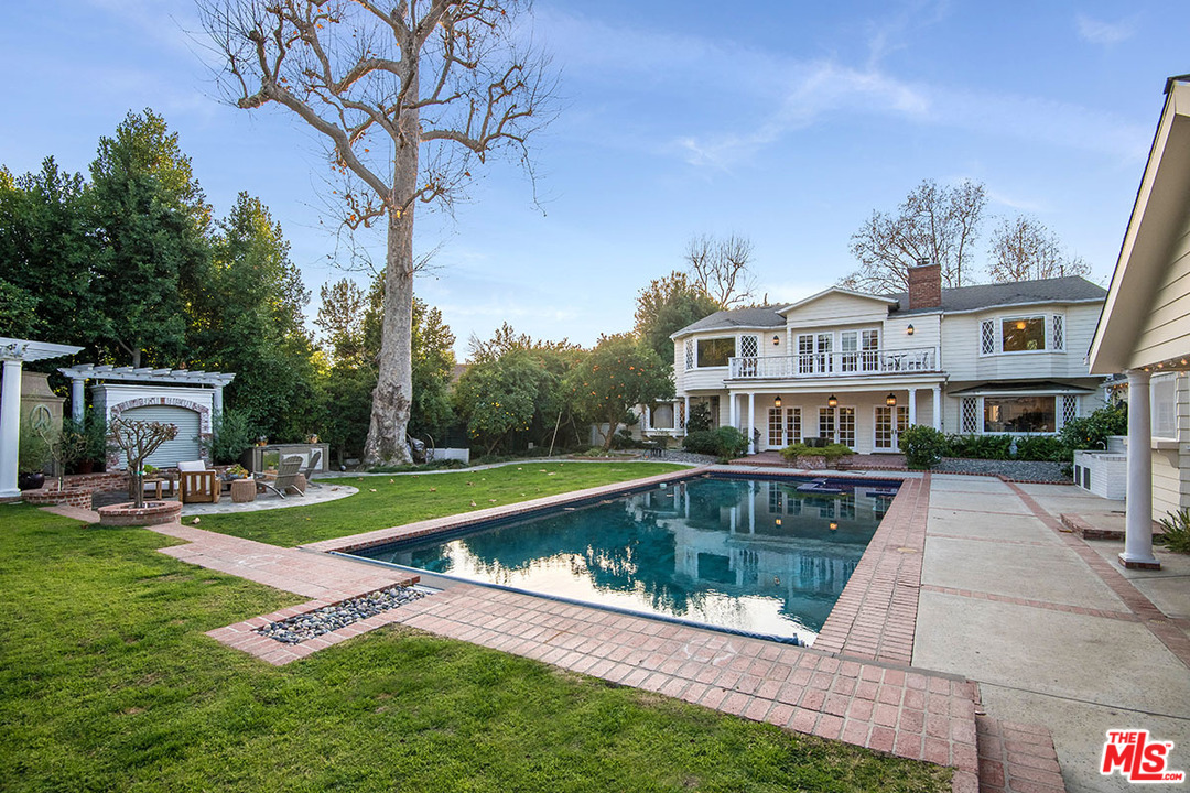 20 Toluca Estates Drive Toluca Lake, CA 91602 - Photo 34 of 46 a view of a house with pool and a yard