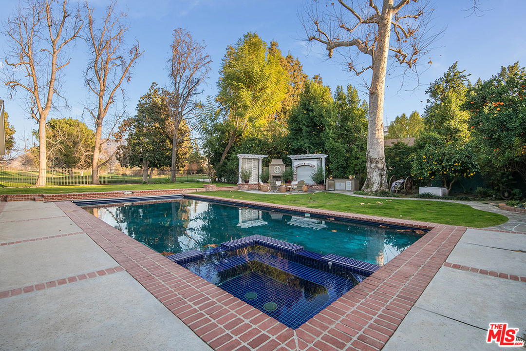 20 Toluca Estates Drive Toluca Lake, CA 91602 - Photo 35 of 46 a view of a swimming pool with a yard