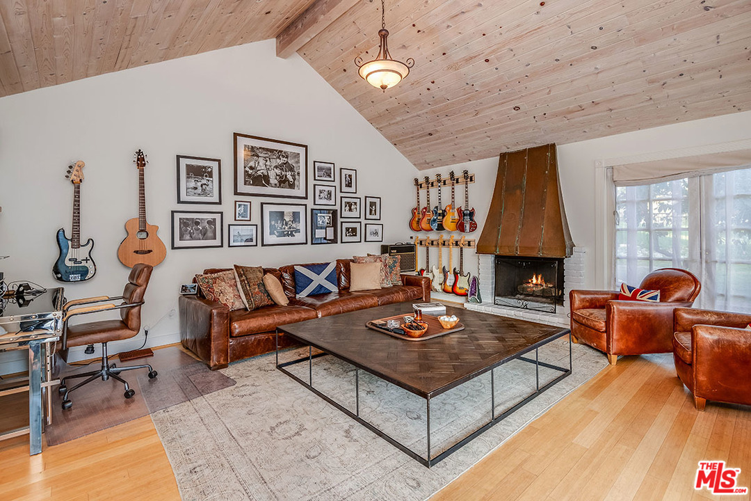 20 Toluca Estates Drive Toluca Lake, CA 91602 - Photo 42 of 46 a living room with furniture and a fireplace