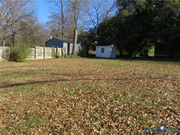 a view of outdoor space with deck and yard